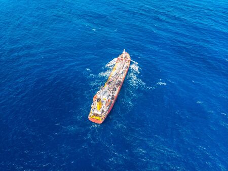 Oil chemical tanker sails blue sea. Aerial top viewの写真素材