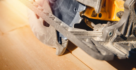 Portable tool circular saw for cutting wood.