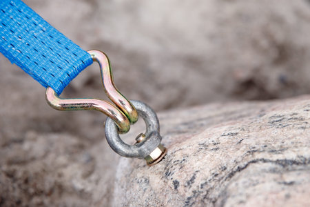 Bolt fastening slings rock climbing into stone.