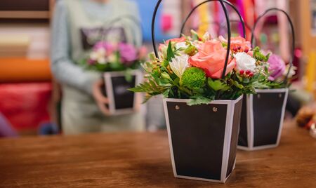 Flower bouquets in gift cardboard boxes in florist shop.の写真素材
