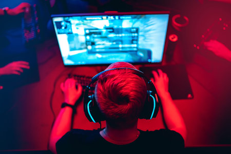 Professional cyber gamer studio room with personal computer armchair, keyboard for stream in neon...