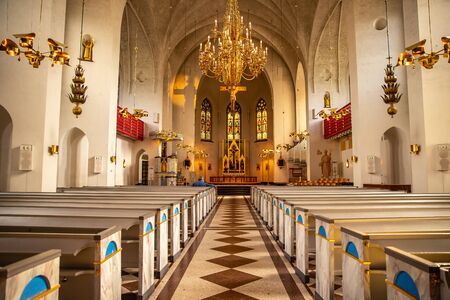 Lulea, Sweden - July 05, 2019: Cathedral Catholic, parishioners prayのeditorial素材