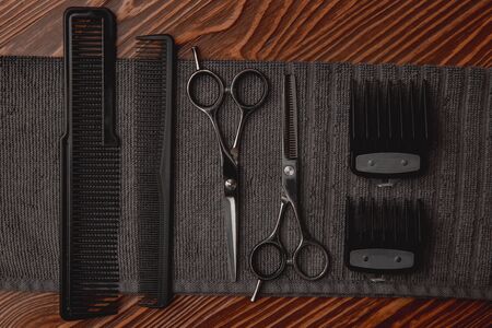 Hairdresser barber shop tools on old wooden background, copy spaceの写真素材