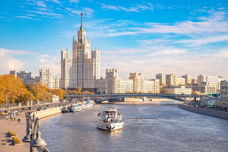 Moscow - October 13, 2018: Scenic panorama Zaryadye Park overlooking river and Stalin skyscraper pleasure boat, Russia autumnのeditorial素材