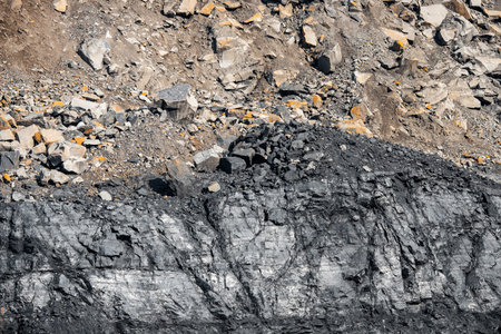 Geological section of soil, layers of coal and rock. Overburden open mine anthracite. Dark texture...