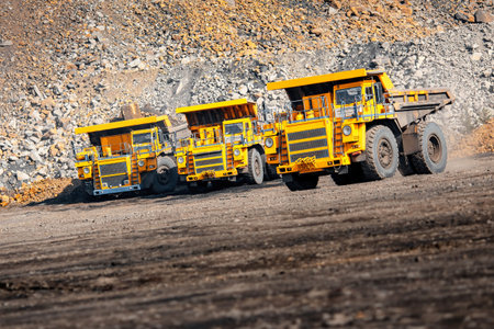 Open pit mine industry. Big yellow mining truck for coal moving on road career.