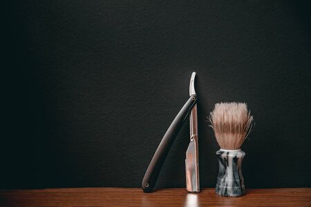 Brush and razor for shaving beard. Concept background of hair salon men, barber shopの写真素材