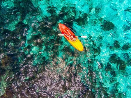 Aerial top view Kayak boat turquoise blue water seaの写真素材