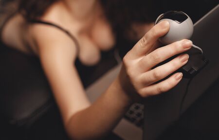 Internet web cam model beautiful woman working online with laptop. Concept virtual sexの写真素材