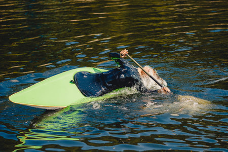 Extreme trick on kayak in mountain river eskimo coup.