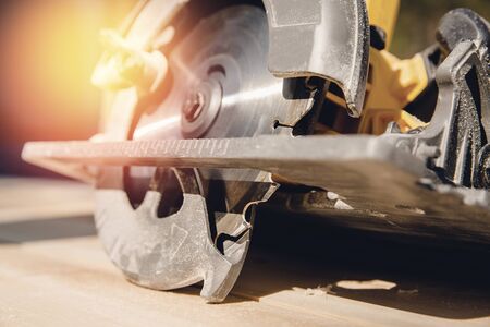 Portable tool circular saw for cutting wood.の写真素材