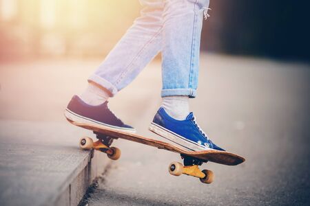 Skateboard man in shoes and jeans getting ready to jump kickflip olli from stepsの写真素材