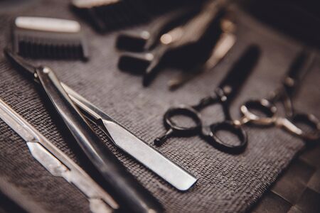 Hairdresser tools: combs, razors, scissors, clip-on hair clipper of barber shop.の写真素材
