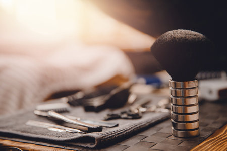 Brush for shaving beard along with bowl, blurred background of hair salon for men, barber shopの写真素材