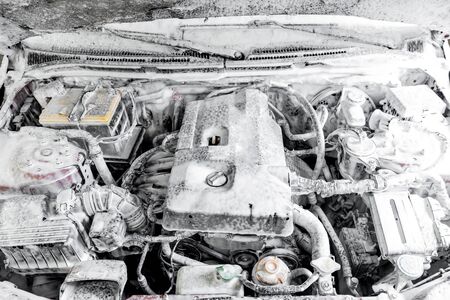 Car service detailing wash, background engine in white foam for cleaning from dirt and oilの写真素材