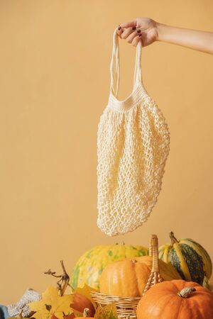 Shopper bag eco friendly for shopping and products, yellow backgroundの写真素材