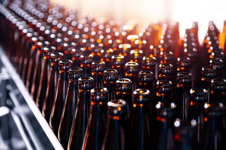 Brown glass beer drink alcohol bottles, brewery conveyor, production lineの写真素材