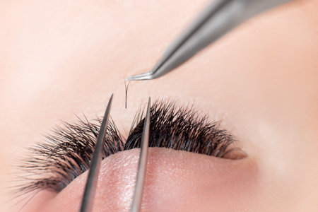 Macro photo woman with long lashes in beauty salon. Concept eyelash extension procedure