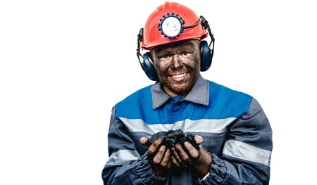 Miner happy man smiling after working on coal mine. Concept industrial engineerの写真素材