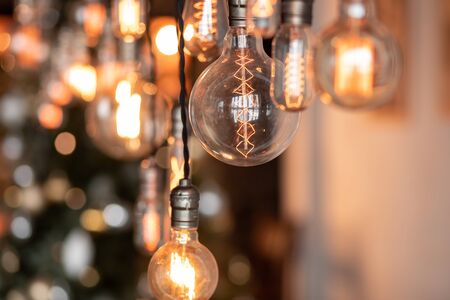 Edison lamp is included in loft room, against background blur bokeh wall.の写真素材