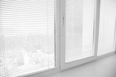 White plastic window upvc angle, detailed design with shutters blinds.の写真素材