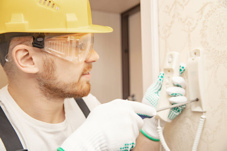 Electrician builder install working repairing intercom phone