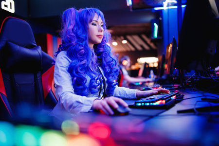 Young woman streamer anime cosplay professional gamer playing video online games computer