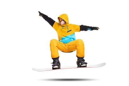 Portrait young man snowboarder jump on snowboard in sportswear isolated white background.の写真素材