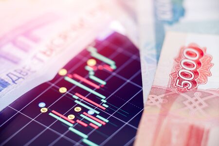 Depreciation ruble exchange rate on international stock and Russian shares of oil and gas enterprises.の写真素材