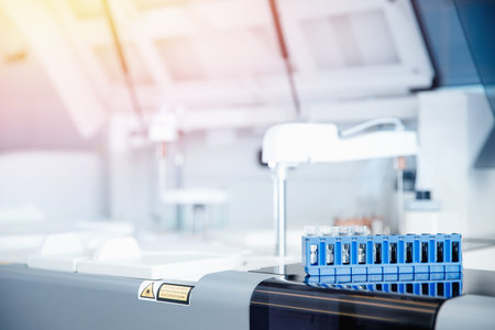 Automatic robot microbiologist analyzing test tube of blood samples for viruses. Concept vaccine...