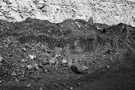 Geological section of soil, layers of coal and rock. Overburden open mine anthracite. Dark texture...