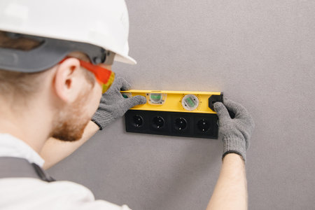 Electrician builder install working switches and sockets black color loft style