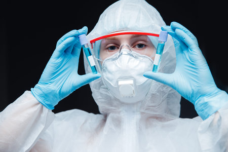Medical female bioengineer researcher performing scientific test in laboratory, working on...
