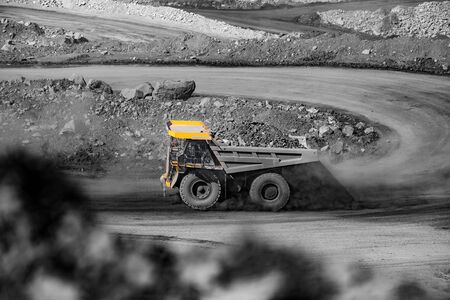 Big yellow mining truck for coal move. Open pit mine industryの写真素材