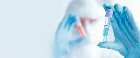 Medical worker in laboratory places blood sample for examination in automatic analyzer. Concept DNA...