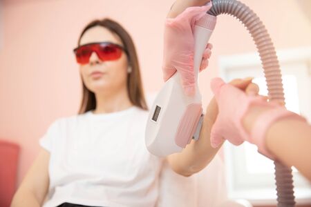 Laser removal Epilation Hair on hand arm young woman. Health and beauty conceptの写真素材