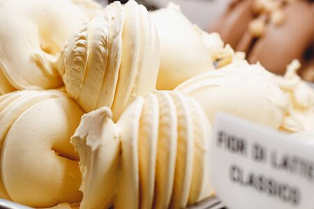 Close-up of Italian ice vanilla cream on counter refrigeratorの写真素材