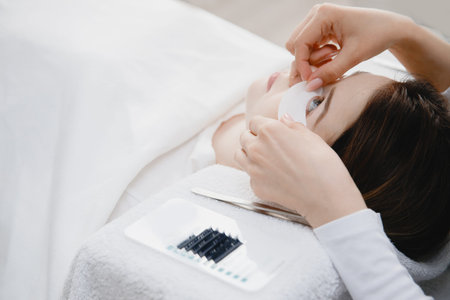 Master making fake set lash Eyelash extension procedure, work with patch for eye