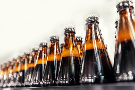 Brown glass beer drink alcohol bottles, brewery conveyor, production line