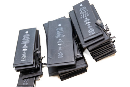 RUSSIA - July 27, 2020: Broken iPhone Apple phone used rechargeable batteries in recycling chip...