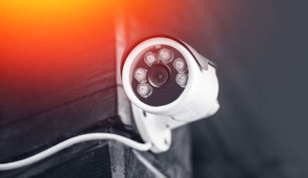 Security CCTV camera in private wooden house building, protection and video recording.の写真素材