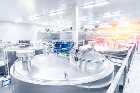 Equipment dairy plant, milk factory industry. Stainless steel storage and processing tanksの写真素材