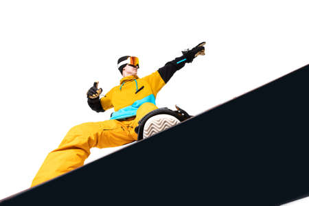 Portrait young man snowboarder jump move on snowboard isolated white backgroundの写真素材