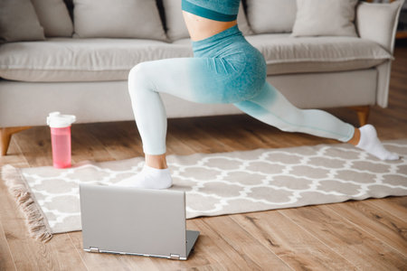 Fitness woman blogger recording video on camera, training home in living room. Concept Lifestyle...