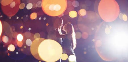 Romantic Lovers couple against background night city, sky star. Concept romance date Valentine Day, first kiss loveの写真素材