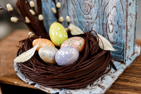 Art pastry chef, chocolate birdhouse with eggs and nest, spring dessert
