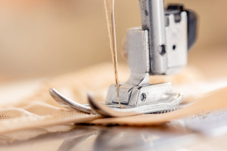 Close-up Automatic sewing machine with fabric and thread