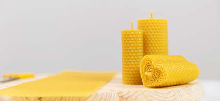 Banner yellow candles made of beeswax with smell of honey on white backgroundの写真素材