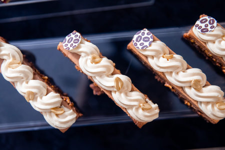 Exhibition of works haute sweet cuisine from pastry chef, chocolate cakes with fresh fruits and...