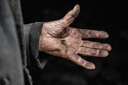 Close up dirty hand hard work of coal miner workerの写真素材